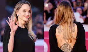Angelina Jolie diện váy lộ hình xăm hổ Angelina Jolie diện váy lộ hình xăm hổ